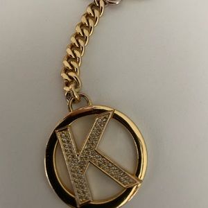 Michael Kors gold key chain- K